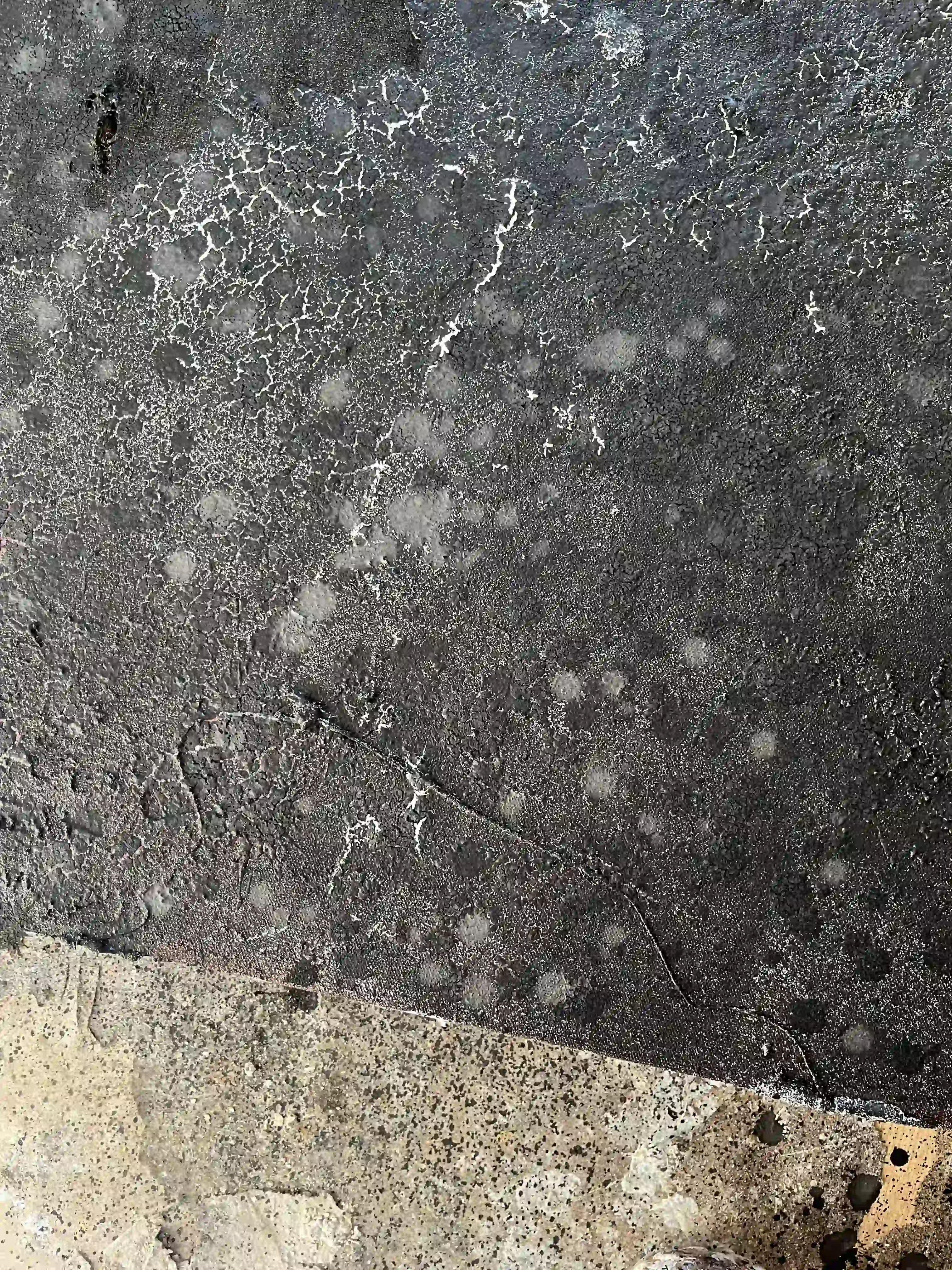 Details of a canvas painting on a studio floor